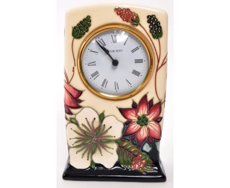 Moorcroft Pottery - A contemporary ceramic mantel clock. Bramble Revisited design with white face, ebonised chapter ring in R
