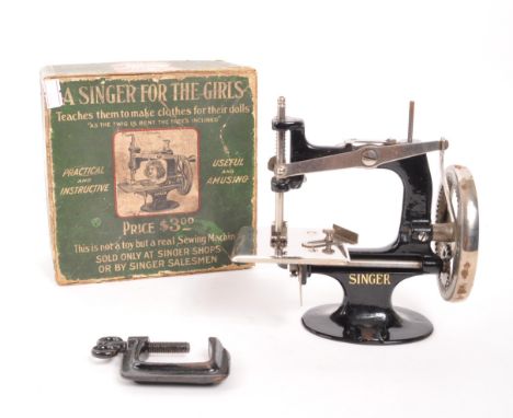 Singer - An early 20th Century miniature Singer sewing machine ' A Singer for the Girls ' in original box. Original instructi