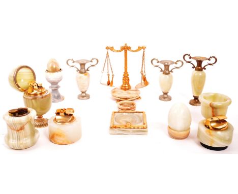 A collection of vintage 20th century onyx items. To include, tabletop lighters, eggs, vases, cups, miniature scales, egg form