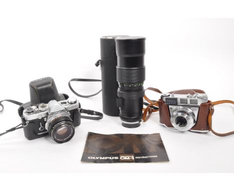 Olympus - A mid 20th century circa 1970s Olympus OM-1 35mm SLR camera. The camera having silver body, in original case. With 