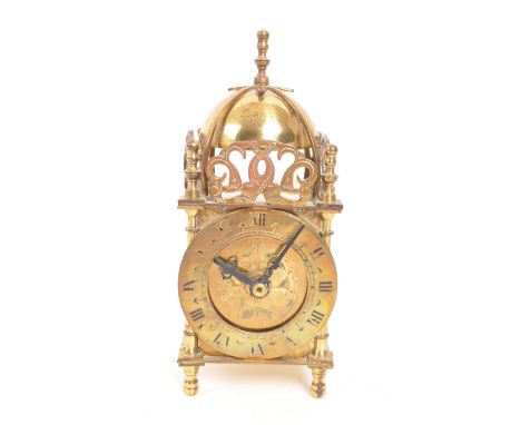 Smiths - A vintage mid 20th century brass lantern mantel clock. With later battery operated movement. Domed top, pierced deco