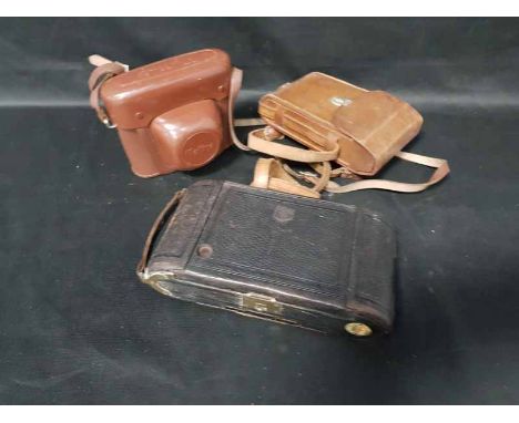 FOUR FOLDING CAMERAS along with Halina SLR Camera and group of accessories including carriage lamp