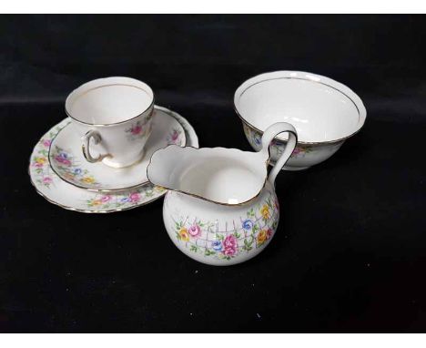 TUSCAN TEA SERVICE WITH FLORAL AND TRELLIS PATTERNincluding two cake plates, two jugs and two sugar bowls