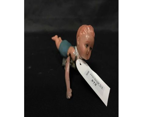 GERMAN MUSICAL CHILDRENS BOOKalso a Japanese celluloid clockwork swimming figure and a portrait watercolour of a young lady