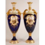 19th century Coalport pair of two handled vases, gilded all over & decorated with panels of