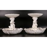 Two late 19th century Copeland porcelain Putti form comports, height of tallest 23cm (2)