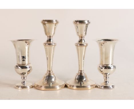 Pair of silver candlestick and a pair of silver vases, both UK hallmarked and with loaded bases.  Gross weight 532g, measurin