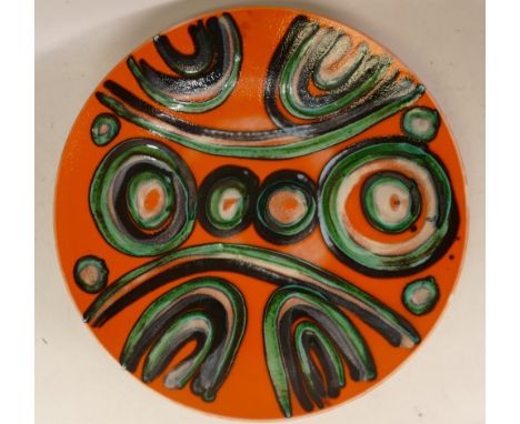 Poole pottery charger on orange ground . 36cm diameter 