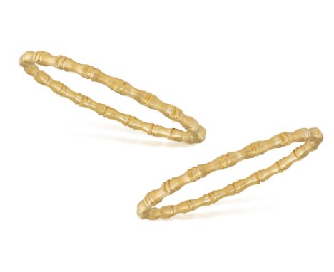 A PAIR OF GOLD BANGLE BRACELETS            Each bangle of bamboo motifs, in 22K gold, inner circumference 19cm Condition Repo
