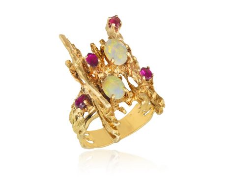 AN OPAL AND RUBY RINGOf openwork organic-shape design, set with cabochon opal and marquise- and pear-shaped rubies, mounted i