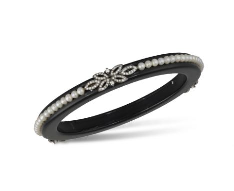A BAKELITE, CULTURED PEARL AND DIAMOND BANGLE BRACELET The black polished bakelite bangle, set with round-shaped cultured pea