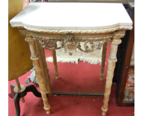 A late 19th century French faded giltwood and gesso white marble topped console table, having a floral decorated frieze, w.65