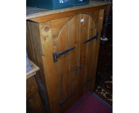 A contemporary stained and planked pine double door side cupboard, having exposed iron hinges, w.86cm