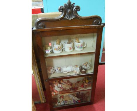 An early Victorian mahogany single door glazed hanging collectors cabinet, with sundry contents to include childs coffee set,