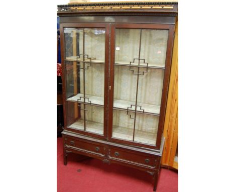 An early 20th century mahogany double door glazed china display cabinet, with twin lower drawers, w.122cm