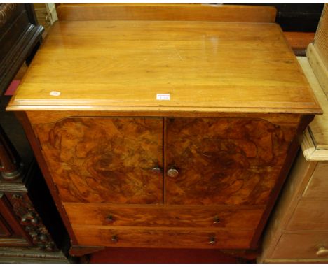 A 1930s figured walnut ledgeback double door side cupboard, having twin long lower drawers, width 77cm