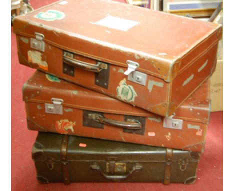 Three various vintage suitcases to include two with luggage labels