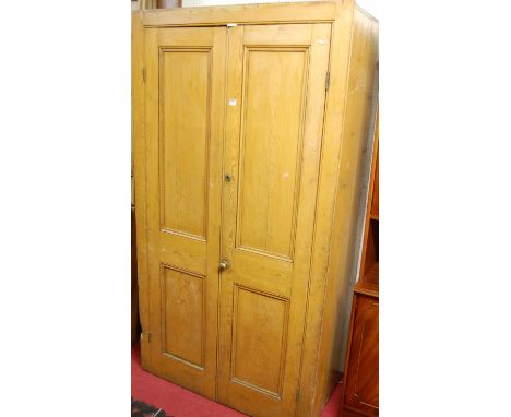 A Victorian stained pine double door pantry cupboard, having fixed interior shelves, w.107cm. Split running down one side ver