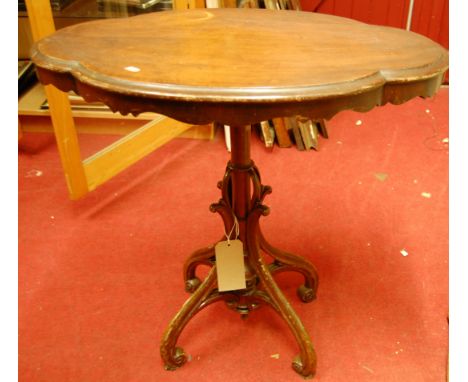 A walnut shaped topped pedestal tripod occasional table, w.76cm