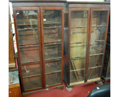 A pair of Regency mahogany double door glazed bookcases, each having beaded detail (one with break to lower glazing panel, th