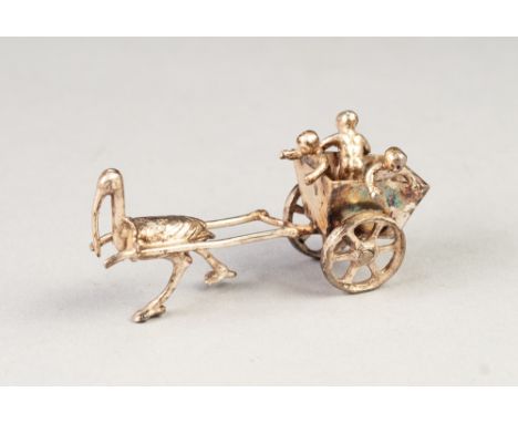 EARLY TWENTIETH CENTURY CONTINENTAL SILVER MINIATURE CABINET ORNAMENT in the form of three putti riding in a two wheeled carr