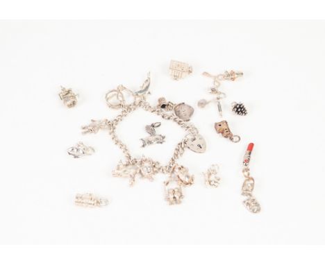 HALLMARKED SILVER CURB PATTERN CHARM BRACELET and padlock clasp with nine silver coloured metal charms attached and  TWELVE L