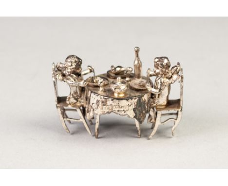 LATE NINETEENTH/EARLY TWENTIETH CENTURY CONTINENTAL SILVER MINIATURE CABINET ORNAMENT  in the form of two cherubs seated at a