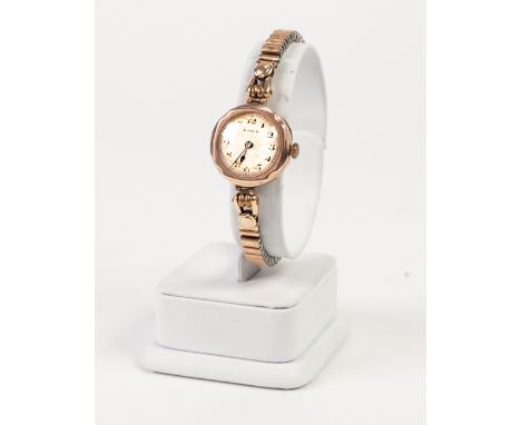 LADY'S ROLEX SWISS WRIST WATCH, with 15 rubies, mechanical movement, circular engine turned silvered Arabic dial, in 9ct gold