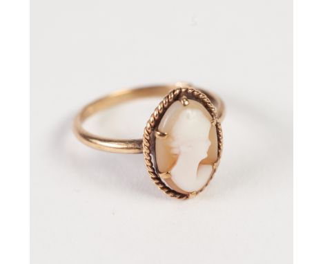 9ct GOLD RING, collet set with an oval shell cameo carved with a female head, 2.6gms 