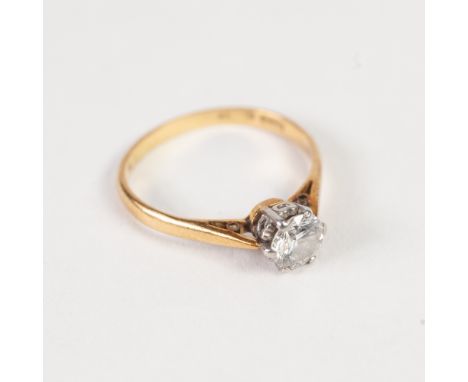 18ct GOLD AND PLATINUM RING, set with a raised round brilliant cut solitaire diamond, approx 3/4ct, 2.5gms, ring size 'O' 