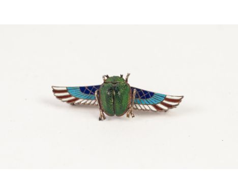 LATE NINETEENTH CENTURY CONTINENTAL SILVER GILT AND POLYCHROME ENAMELLED EGYPTIAN REVIVAL BROOCH WING PATTERN BROOCH, the cen