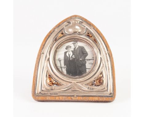 EDWARDIAN SILVER EASEL PHOTOGRAPH FRAME,  of lancet shape and Art Nouveau embossed silver front, 4" high,  Birmingham 1905 ma