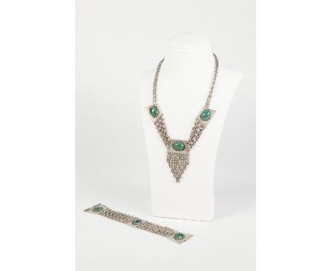 SILVER COLOURED METAL FANCY CHAIN NECKLACE, the three strand front linking three rectangular panels, each set with a cabochon
