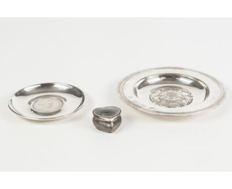 A MODERN SILVER SHALLOW DISH, the centre in bossed relief with a Lancashire Rose, London 1968, a SMALL SILVER ASHTRAY, the ce