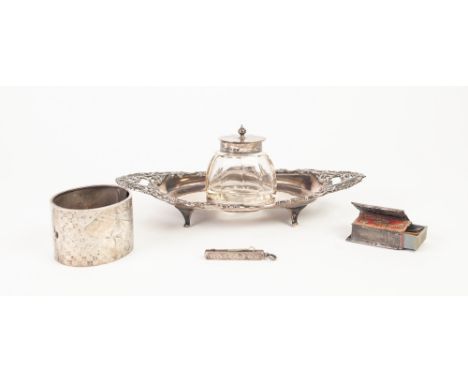 AN EARLY TWENTIETH CENTURY SILVER BOOT SHAPE INKSTAND, the border cast and pierced with Rocaille scrollwork, with removable s