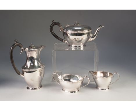 AN INTER-WAR YEARS ELECTROPLATED FOUR PIECE TEA AND COFFEE SERVICE of oval form with Celtic style borders 