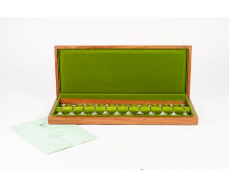 A CASED LIMITED EDITION SET OF 12 'ROYAL HORTICULTURAL SOCIETY' SILVER AND PARCEL GILT FLOWER SPOONS, each with a gilt oval t