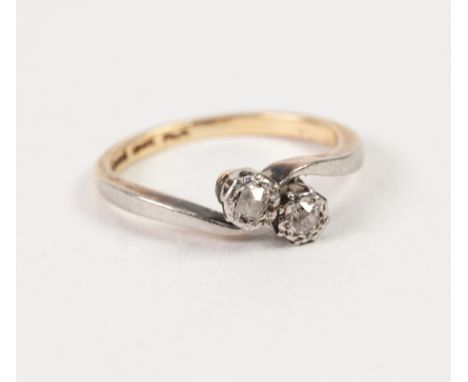 18ct GOLD AND PLATINUM CROSS OVER RING, set with two old cut diamonds in deceptive settings, approx .10ct in all, 2.6gms, rin