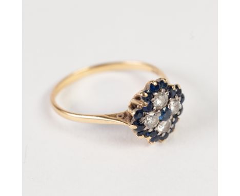 18ct, DIAMOND AND SAPPHIRE QUATREFOIL CLUSTER RING,  set with a small centre sapphire with surround of four small old cut dia