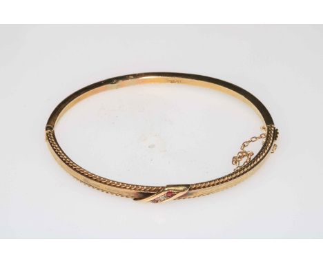 15 carat gold bangle set with diamond and two rubies.