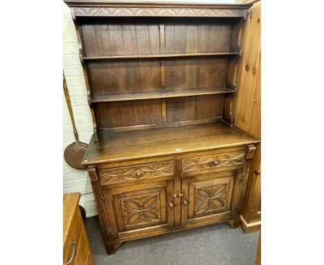 Carved oak shelf back dresser, 185cm by 127cm by 48cm.