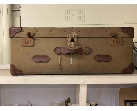 Vintage canvas and leather bound travelling trunk, 36cm by 91cm by 51cm.