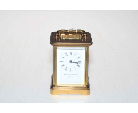Gilt brass carriage clock, the face signed by retailer Matthew Norman, London.