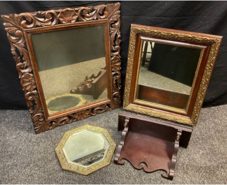 An early 20th century carved oak framed looking glass, 49cm x 39cm plate size (70cm x 59cm overall);  a gilt framed wall mirr