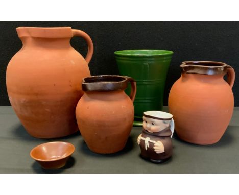 Ceramics - a graduated trio of C H Brannam terracotta  jugs; Denby AMD banded green trumpet vase;  etc (6) 