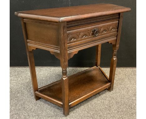 An Old Charm style oak hall table, canted rectangular top, single drawer to frieze, shelf to base, 72.5cm high x 80cm wide x 