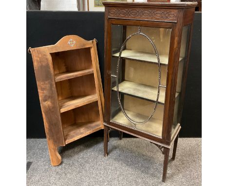 An Edwardian mahogany vitrine display cabinet, carved frieze, glazed sides and door enclosing two tiers of shelving, tapered 