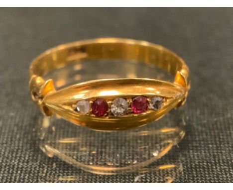 A diamond and ruby ring, alternate set with two pinky red rubies and three diamond dividers, 18ct gold shank, size N, 2.4g gr