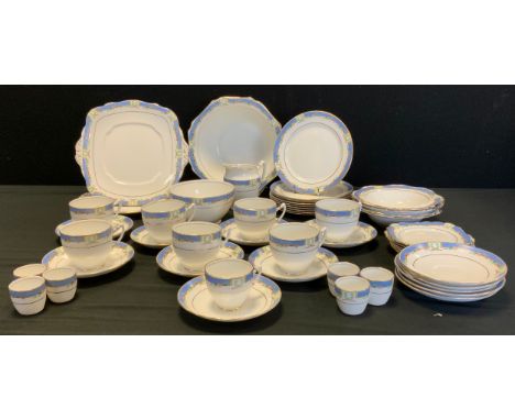 A Royal Albert Orient pattern breakfast service for six comprising cups, saucers, side plates, egg cups, fruit bowls, tea pla