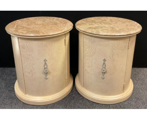 A pair of contemporary limed ash bedside cabinets, of cylindrical form, circular Fendi-Beige marble tops, curved door enclosi